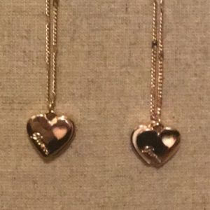 Guess necklace double heart. 1 white  & 1 pink